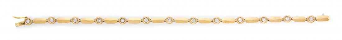 An 18 Karat Yellow Gold and Diamond Bracelet, 7.30: An 18 Karat Yellow Gold and Diamond Bracelet, consisting of elongated yellow gold bar links alternating with thirteen bezel set round brilliant cut diamonds weighing approximately 1.30 carats total. S