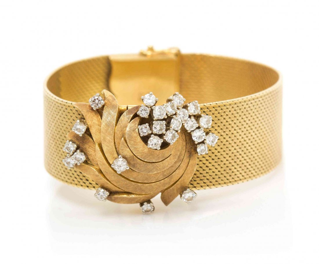 An 18 Karat Yellow Gold and Diamond Surprise Watch,: An 18 Karat Yellow Gold and Diamond Surprise Watch, Bucherer, hinged cover containing 26 round brilliant cut diamonds weighing approximately 1.82 carats total, matte silvered dial signed Bucherer, app