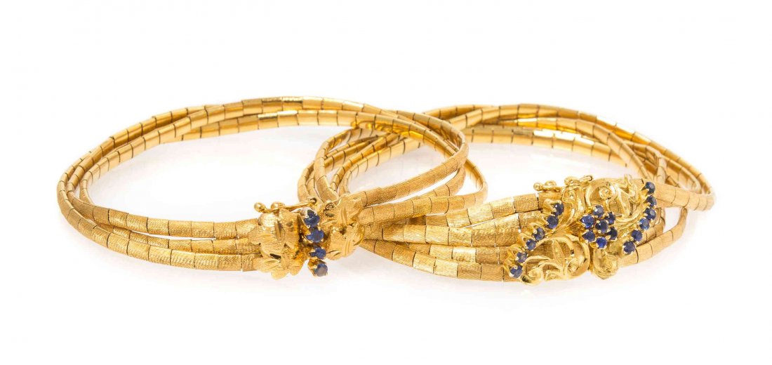 A Collection of 18 Karat Yellow Gold and Sapphire: A Collection of 18 Karat Yellow Gold and Sapphire Bracelets, consisting of two multi strand flat link bracelets with a Florentine finish containing 23 round cut sapphires measuring approximately 1.89-