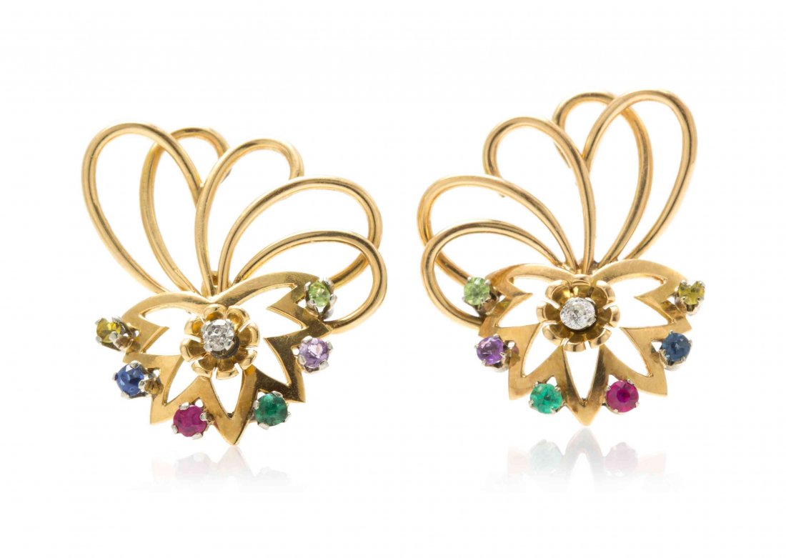 A Pair of 18 Karat Yellow Gold and Multi Gem Earclips,: A Pair of 18 Karat Yellow Gold and Multi Gem Earclips, containing two old mine cut diamonds weighing approximately 0.05 carat total, two round cut citrines, sapphire, ruby, emerald, amethyst and perid