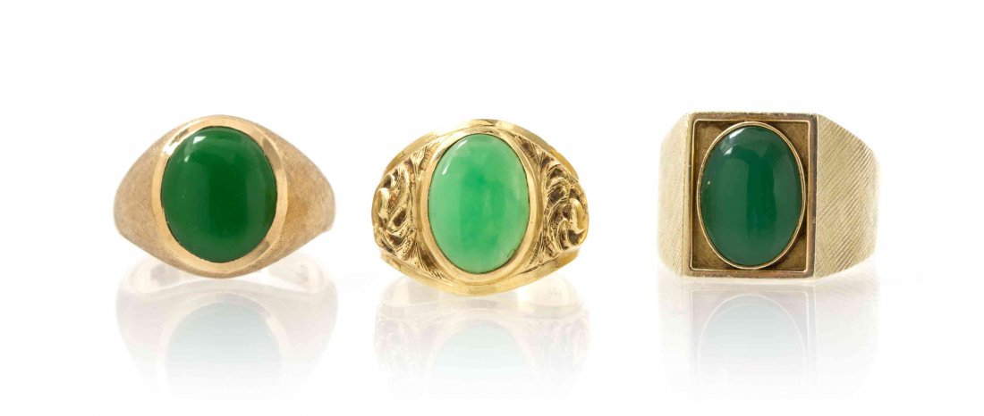 A Collection of Yellow Gold and Dyed Chalcedony Rings,: A Collection of Yellow Gold and Dyed Chalcedony Rings, consisting of a 14 karat yellow gold ring containing one oval cabochon cut dyed green chalcedony, a 10 karat yellow gold ring containing one oval