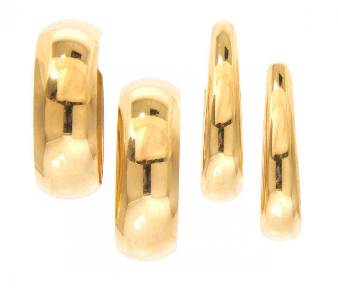 A Collection of Yellow Gold Hoop Earrings, 11.70 dwts.: A Collection of Yellow Gold Hoop Earrings, consisting of a pair of elongated oval hoop earrings and a pair of 14 karat yellow round hoop earrings. 11.70 dwts.