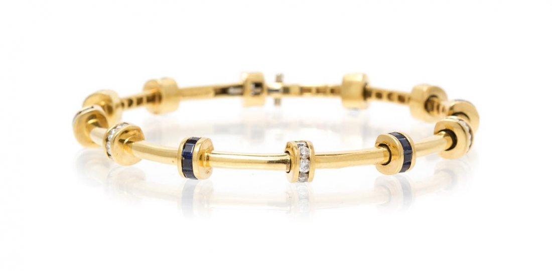 An 18 Karat Yellow Gold, Sapphire and Diamond Bracelet,: An 18 Karat Yellow Gold, Sapphire and Diamond Bracelet, Charles Krypell, consisting of 12 stations containing 30 square step cut sapphires weighing approximately 2.40 carats total and 30 round brillia