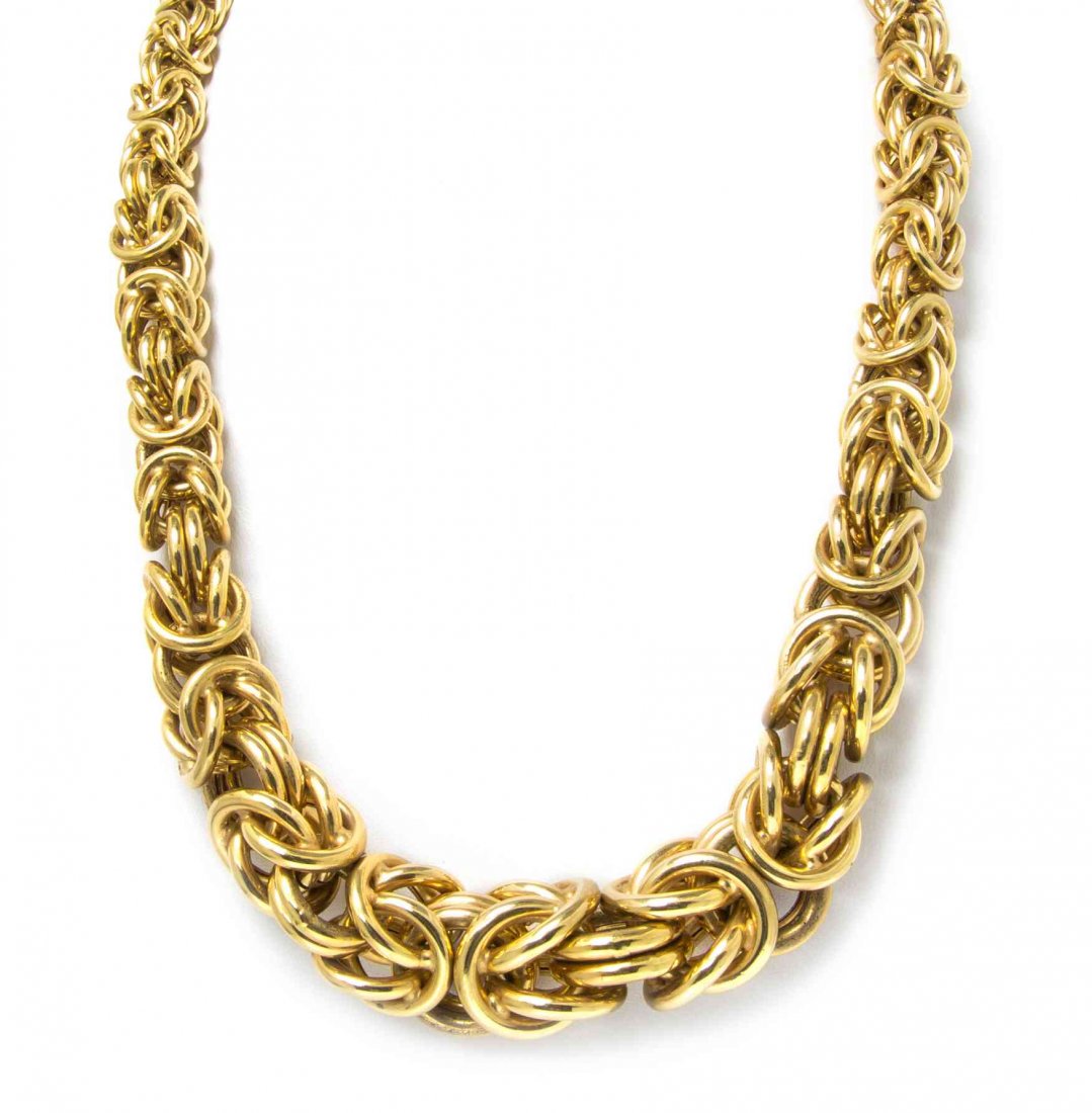 An 18 Karat Yellow Gold Graduated Byzantine Link: An 18 Karat Yellow Gold Graduated Byzantine Link Necklace. Stamp: 750 (makers mark). 77.40 dwts. Property from the Estate of Judith Wright, Sheboygan, Wisconsin Condition: Note: tests for low 18K.