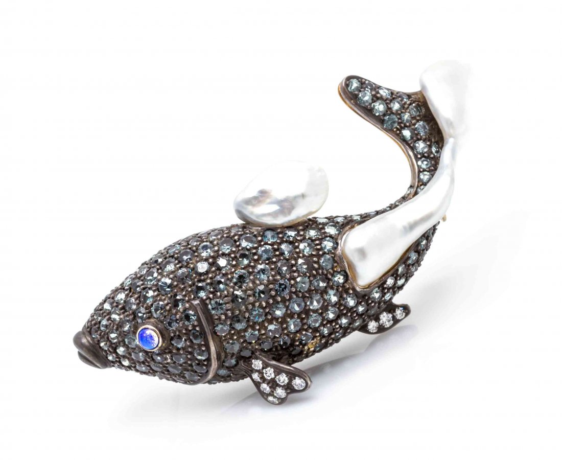 An 18 Karat Gold, Silver, Multi Gem and Cultured Pearl: An 18 Karat Gold, Silver, Multi Gem and Cultured Pearl Fish Brooch, in a gold backed silver design, the domed body pave set with numerous round mixed cut green chrysoberyl, the bottom fins containing