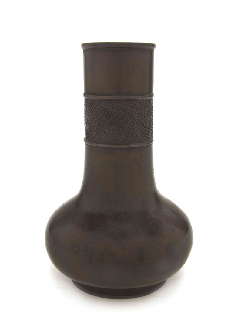 A Bronze Vase, Height 7 1/4 inches.: A Bronze Vase, of bottle form, the neck decorated with a band of wan symbols. Height 7 1/4 inches. Property from the Hugh Johnston Hubbard Trust, Lake Forest, Illinois
