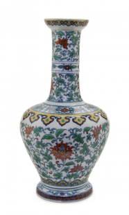 A Doucai Porcelain Bottle Vase, Height 10 1/2 inches.: A Doucai Porcelain Bottle Vase, YONGZHENG MARK AND PERIOD (1723-1736) having a cupped mouth with ruyi band over the cylindrical neck with two bow strings and scrolled lotus decoration, the shoulder wi