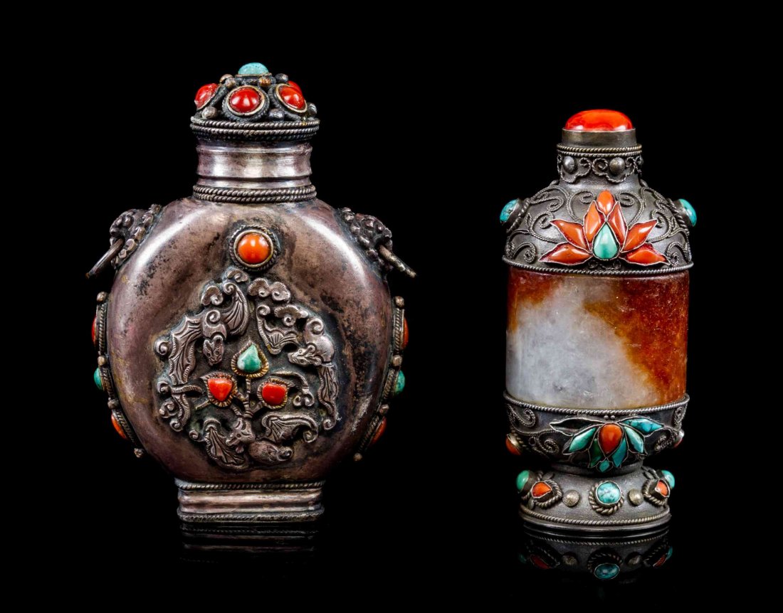 Two Mongolian Snuff Bottles, Height overall of taller 3: Two Mongolian Snuff Bottles, the first with a jadeite archer's ring incorporated in the body, the other of flask form, each with coral and turquoise inlay to the silver bodies. Height overall of talle