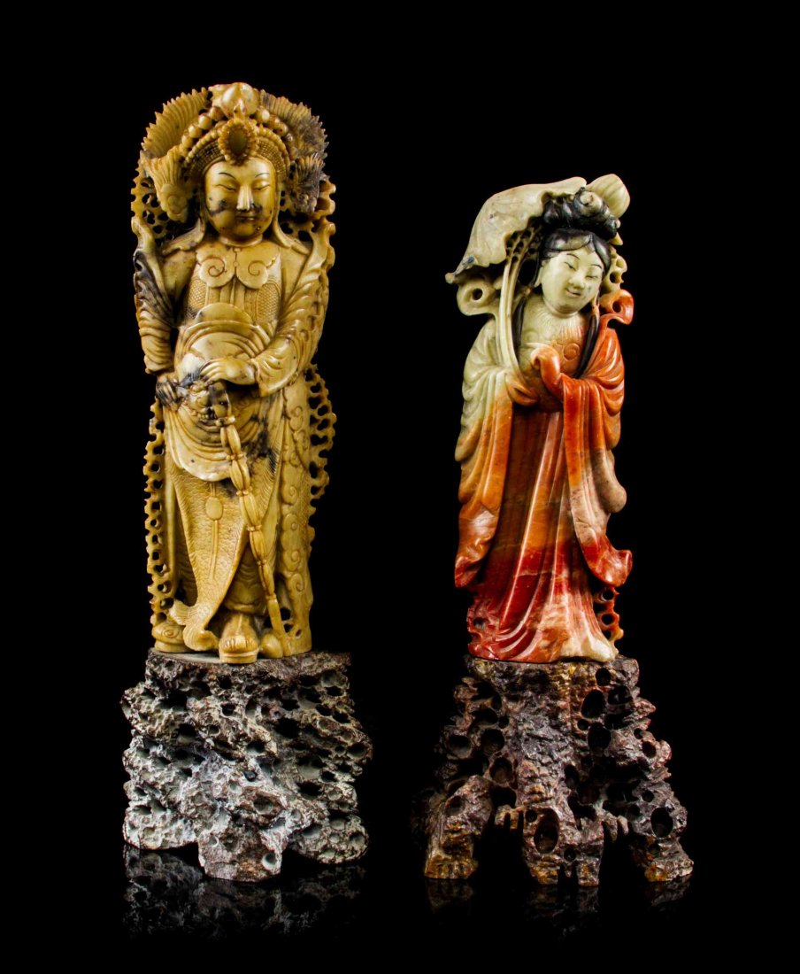 Two Soapstone Figural Carvings, Height of taller 8 5/8: Two Soapstone Figural Carvings, one depicting a warrior and the other depicting a lady, both raised on stone stands. Height of taller 8 5/8 inches.