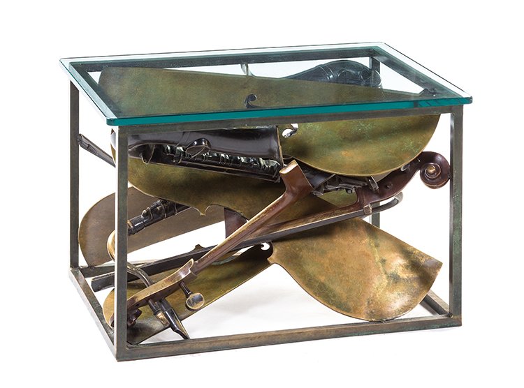 Arman, (American/French, 1928-2005), Musical Instrument: Arman (American/French, 1928-2005) Musical Instrument Table bronze and glass 18 1/2 x 29 x 21 inches. Provenance: Hotel Le Parc, Le Parc Jazz Lounge, Paris, France Condition: Please contact us for a c