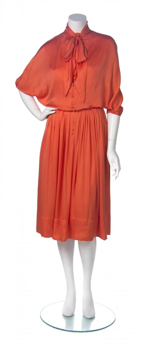 A Donald Brooks Coral Dress,: A Donald Brooks Coral Dress, dolman sleeves with a blouson bodice, a fitted waist and matching belt. Labeled: Donald Brooks. Property donated by Patrons and friends of the Des Moines Art Center, For t