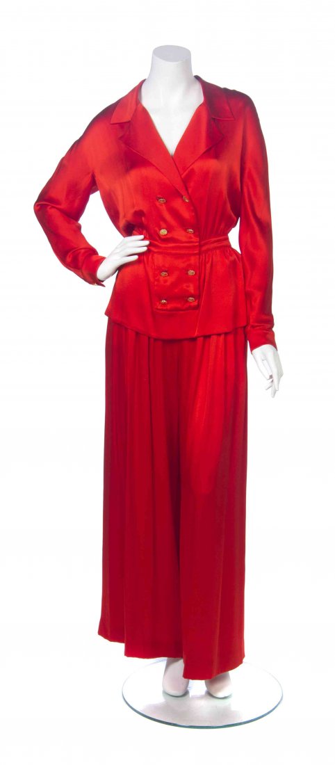 A Chanel Red Silk Pant Ensemble, Pant size 38.: A Chanel Red Silk Pant Ensemble, comprised of a jacket with a closed double-breasted panel to the center front, embellished with goldtone Coco Chanel buttons, together with a pair of palazzo pants. La