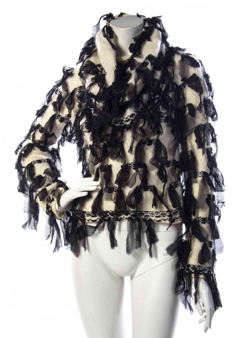 A Christian Dior Ivory Silk and Mohair Hobo Sweater,: A Christian Dior Ivory Silk and Mohair Hobo Sweater, long sleeves, with a cowl neck, and strips of black chiffon interwoven throughout. Labeled: Christian Dior. Size 8. Condition: Overall excellent co
