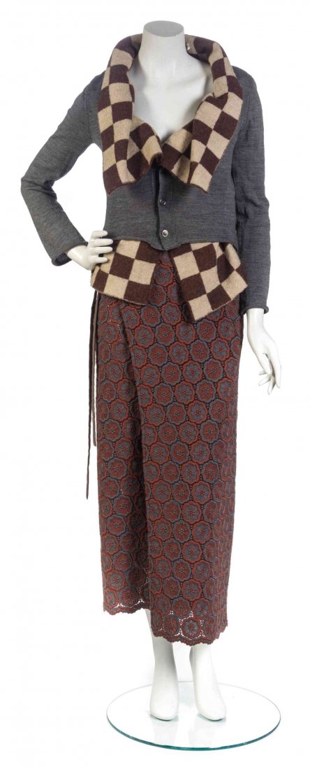 A Comme des Garcons Skirt Ensemble, Top size S, skirt: A Comme des Garcons Skirt Ensemble, comprised of a button down grey wool cardigan with a cream and brown checker layered vest, together with a brown and rust flower crochet wrap skirt. Labeled: Comme