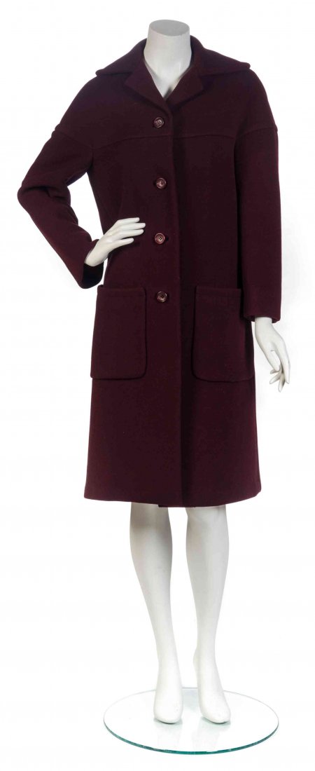 A Donald Brooks Maroon Wool Coat,: A Donald Brooks Maroon Wool Coat, 1960's, dropped shoulders, button down front with two patch pockets. Labeled: Donald Brooks.