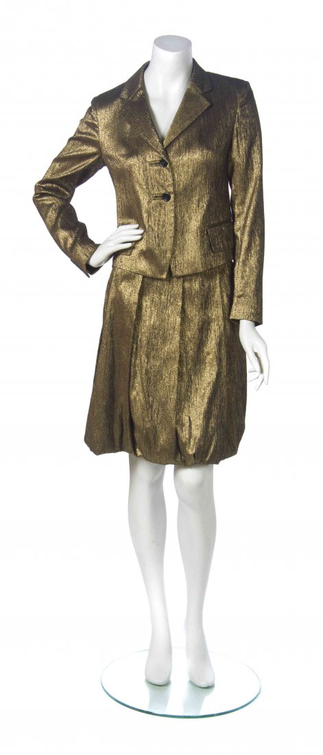 A Dries Van Noten Gold Metallic Skirt Suit, Jacket size: A Dries Van Noten Gold Metallic Skirt Suit, comprised of a single breasted jacket together with a pleated skirt with a slight bubble hem. Labeled: Dries Van Noten. Jacket size 40, skirt size 38. Condi