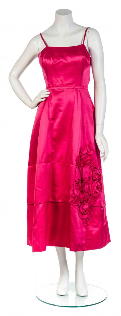 An Elizabeth Arden Hot Pink Silk Dress,: An Elizabeth Arden Hot Pink Silk Dress, camisole straps, with rosettes embroidered to bottom left portion of skirt, and a double tiered hem. Labeled: Elizabeth Arden New York. Condition: Measurements: