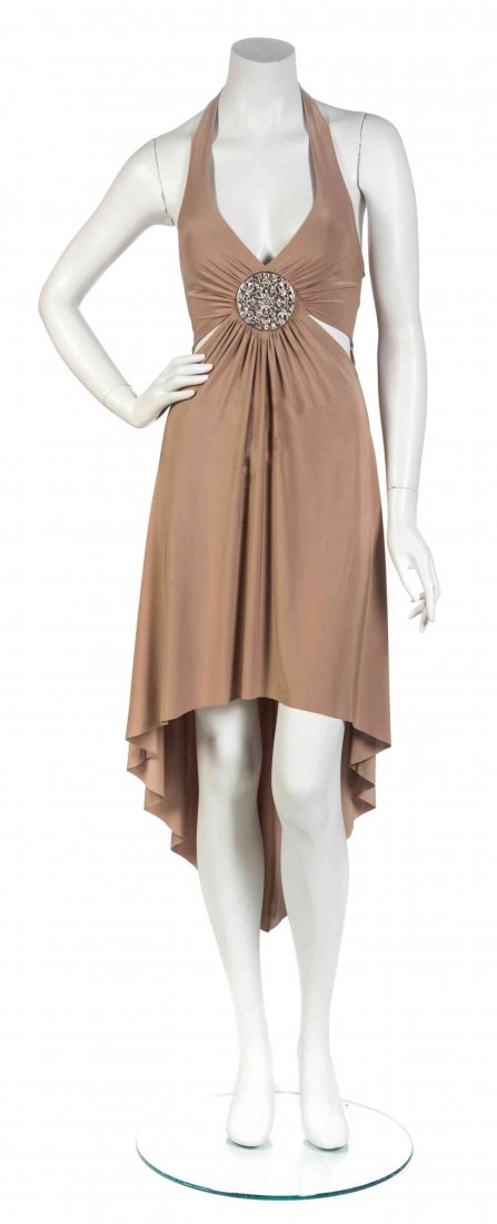 A Gianni Versace Couture Nude Jersey Halter Dress, Size: A Gianni Versace Couture Nude Jersey Halter Dress, deep V-neckline with a rhinestone and crystal medallion, cut outs at the waist, longer hem in back. Labeled: Gianni Versace Couture. Size S.
