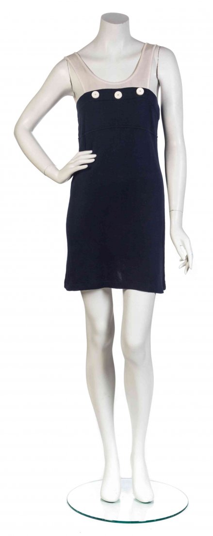 A Karl Lagerfeld Navy Blue and White Contrast Knit: A Karl Lagerfeld Navy Blue and White Contrast Knit Dress Ensemble, comprised of a tank style dress with white contrast buttons, together with an A-line white button down top. Labeled: Karl Lagerfeld. 