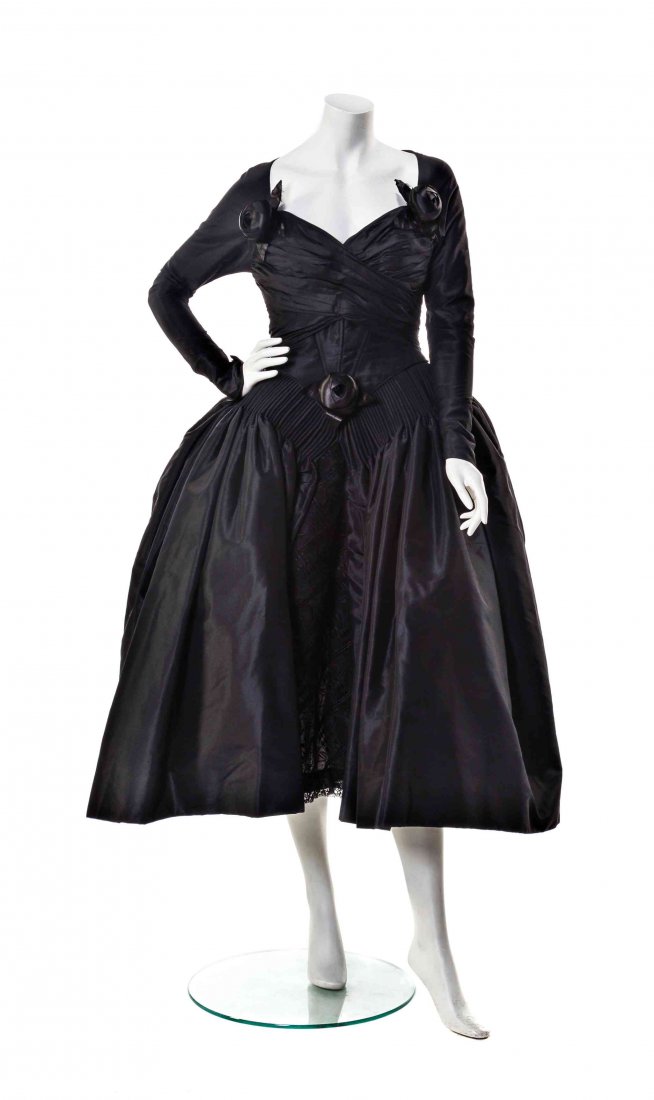 A Karl Lagerfeld Black Runway Dress,: A Karl Lagerfeld Black Runway Dress, circa 1989, long sleeves with self-covered buttons, a ruched and corseted bodice with a sweetheart neckline, fitted waist, and a pannier inspired hip line. Labeled