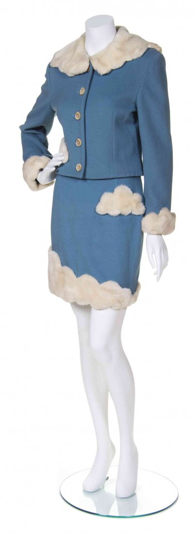 A Moschino Powder Blue Wool 'Head in the Clouds' Skirt: A Moschino Powder Blue Wool 'Head in the Clouds' Skirt Suit, fur cloud trim throughout, full length sleeves to jacket, mother of pearl buttons, 'Head in the Clouds' embroidered in gold at back. Labele