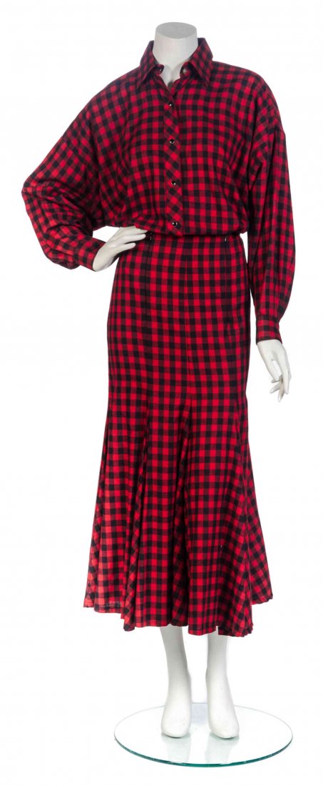 A Norma Kamali Red and Black Cotton Plaid Skirt: A Norma Kamali Red and Black Cotton Plaid Skirt Ensemble, 1980's, comprised of a long sleeve snap button down shirt, together with a fitted skirt in a trumpet silhouette. Labeled: Norma Kamali.