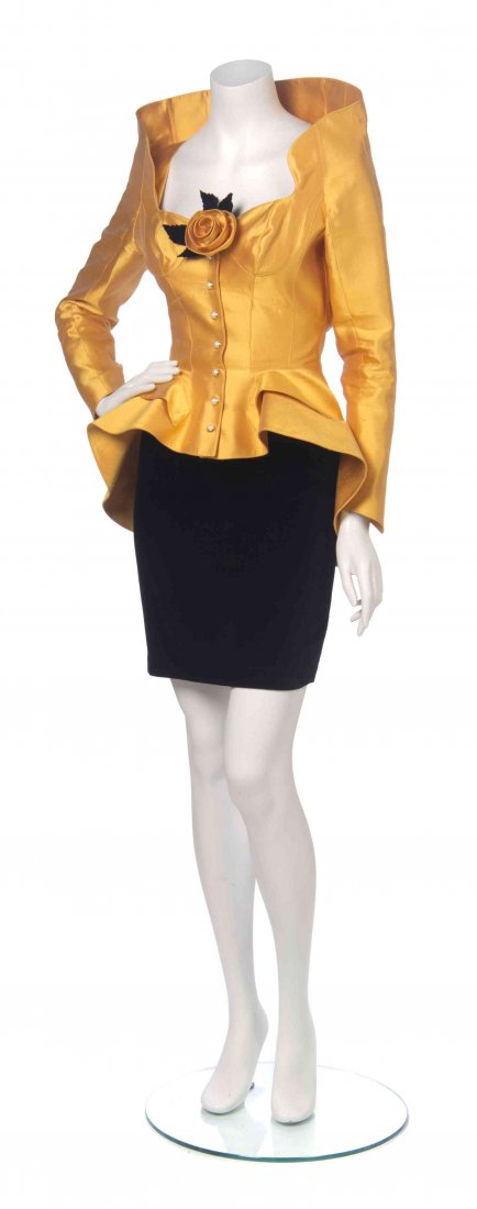 A Thierry Mugler 'High Style' Marigold and Black: A Thierry Mugler 'High Style' Marigold and Black Cocktail Ensemble, comprised of an off-the-shoulder marigold silk jacket, with a modified sweetheart neckline, faux pearl dome buttons, a tiered peplum