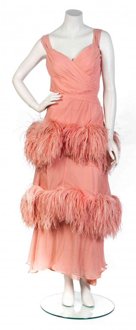 A Valentino Couture Pink Chiffon and Feather Gown,: A Valentino Couture Pink Chiffon and Feather Gown, sleeveless, pleated bodice and an ostrich feather trimmed skirt, together with a matching feather trimmed chiffon shawl. Labeled: Valentino Couture. 