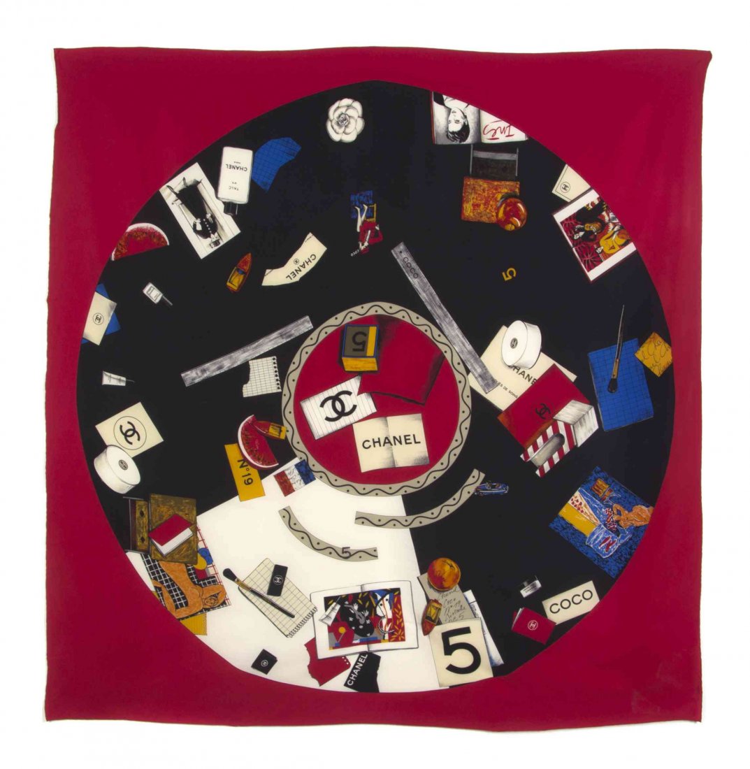 A Chanel Red Silk Scarf, 53 x 55 inches.: A Chanel Red Silk Scarf, in a vanity keepsake motif. Labeled within print: Chanel. 53 x 55 inches. Property from the Estate of Dorothy Parrott Hughes, Kenilworth, Illinois Condition: Overall very good