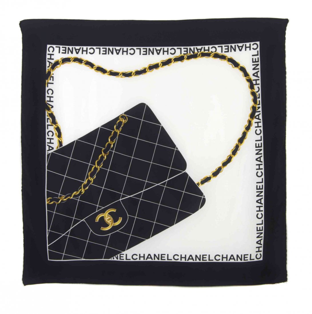 A Chanel Black and White Silk Scarf, 34 x 35 inches.: A Chanel Black and White Silk Scarf, in a Chanel quilted bag motif. Labeled within print: Chanel. 34 x 35 inches. Property from the Estate of Dorothy Parrott Hughes, Kenilworth, Illinois Condition: Ov