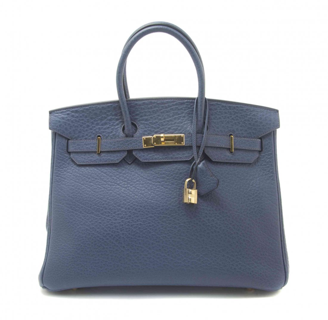 An Hermes 35cm Blue Veau Porc Leather Birkin Bag, 14 x: An Hermes 35cm Blue Veau Porc Leather Birkin Bag, 2001, gold hardware, lock and key sheath, blindstamp square E. Stamped: Hermes. 14 x 10 x 7 inches. Property from the Collection of a Lady, New York a