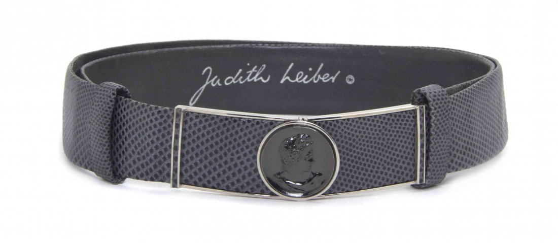 A Judith Leiber Grey Snakeskin Belt, 23 inches.: A Judith Leiber Grey Snakeskin Belt, adjustable, with silvertone hardware, and a cameo buckle. Stamped: Judith Leiber. 23 inches. Condition: Overall good condition. Please note the following: Wear and