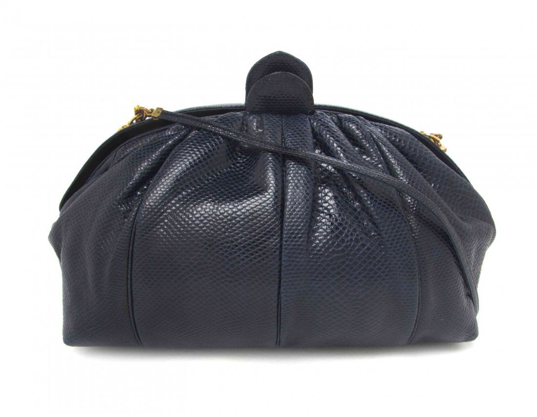 A Judith Leiber Blue Karung Snakeskin Bag, 10 x 7 1/2 x: A Judith Leiber Blue Karung Snakeskin Bag, snap button closure, single shoulder strap, with interior scalloped and zippered pockets, accessories included. Stamped: Judith Leiber. 10 x 7 1/2 x 5 inches