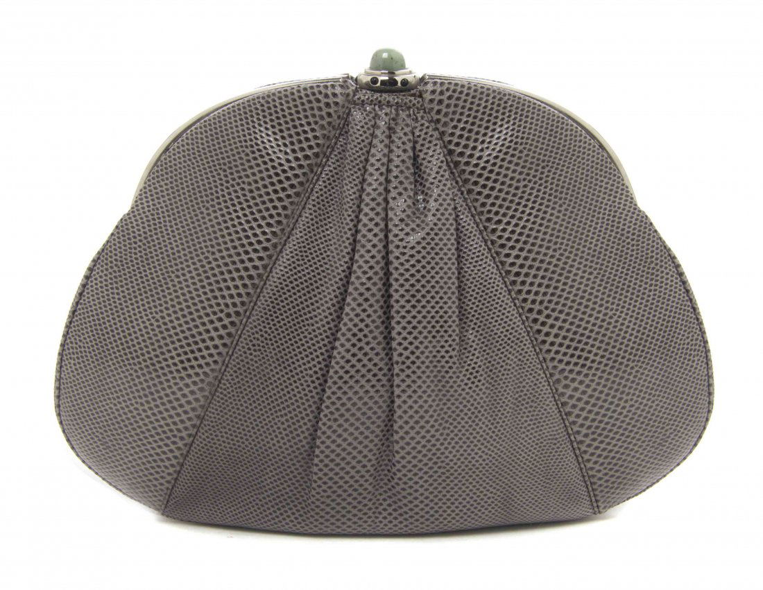 A Judith Leiber Grey Karung Snakeskin Bag, 9 3/4 x 7: A Judith Leiber Grey Karung Snakeskin Bag, silvertone and cabochon push down clasp, single shoulder strap, interior scalloped and zippered pockets, accessories included. Stamped: Judith Leiber. 9 3/4
