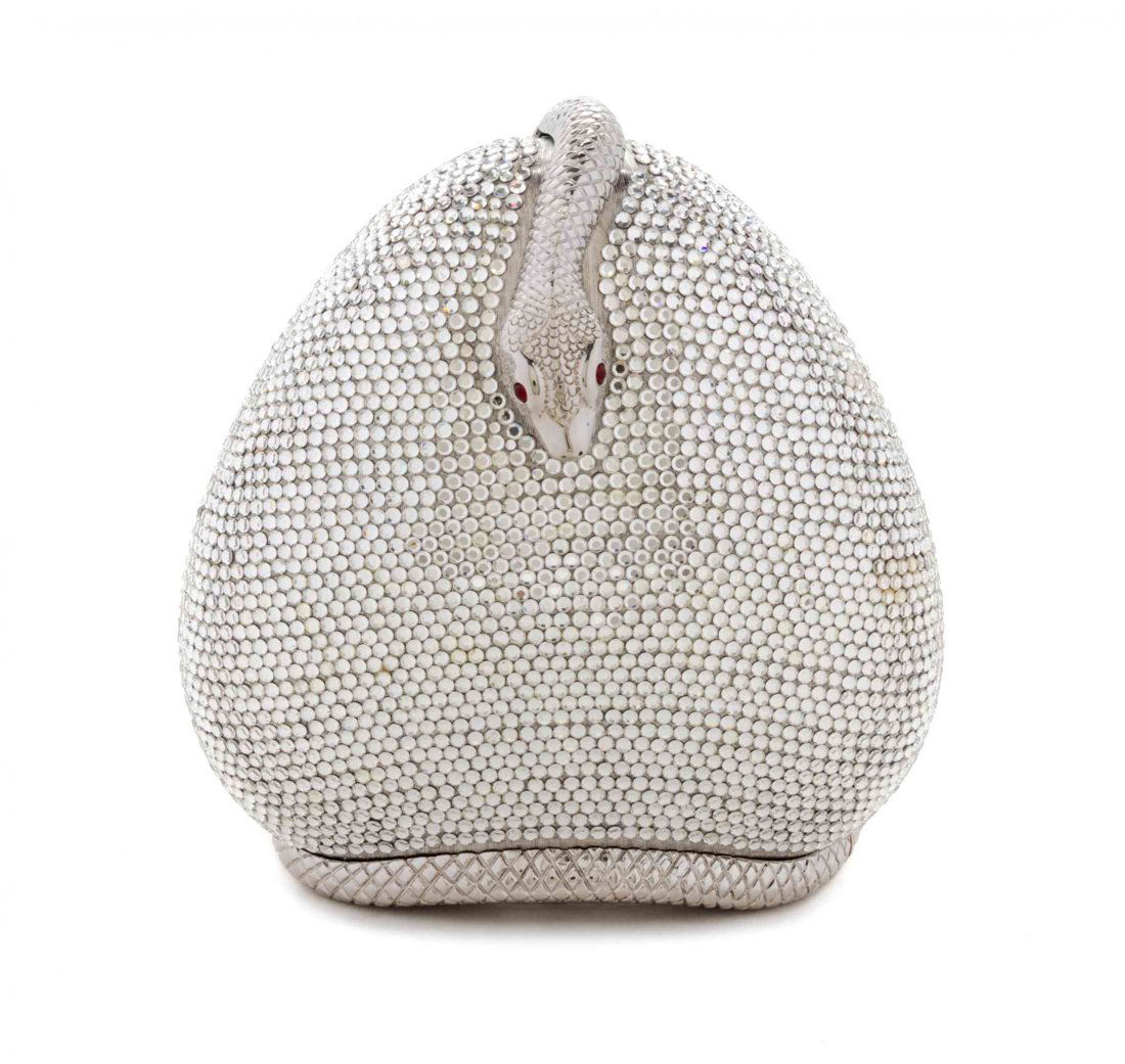 A Judith Leiber White Swarovski Crystal Minaudiere, 5 x: A Judith Leiber White Swarovski Crystal Minaudiere, with a silvertone snake coiled around the exterior, side push clasp closure, with a drop in silvertone chain strap, silver kid lining, accessories i
