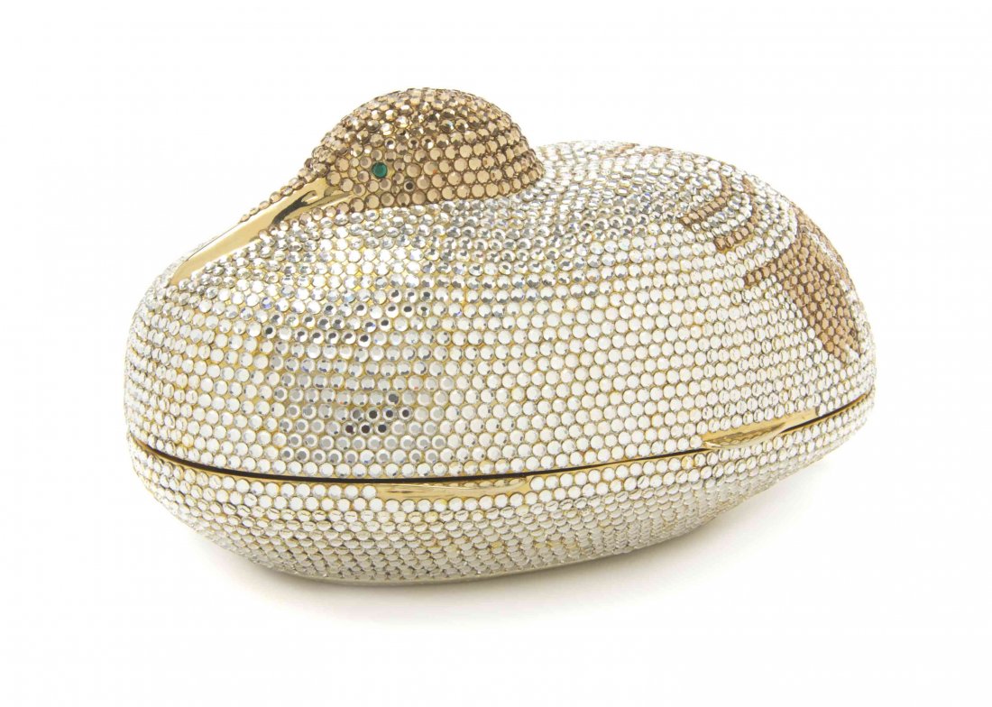 A Judith Leiber Gold and White Swarovski Crystal Duck: A Judith Leiber Gold and White Swarovski Crystal Duck Minaudiere, gold kid lining, with an interior slip pocket, mirror and comb accessories included. Stamped: Judith Leiber. 6 x 3 x 3 inches. Propert
