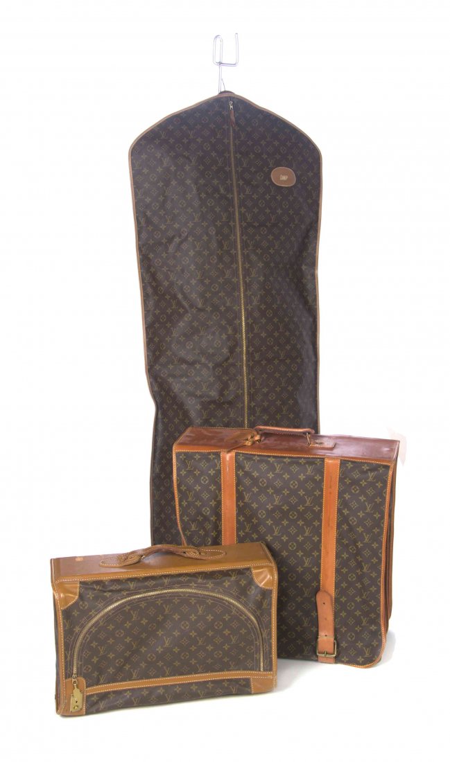 A Group of Louis Vuitton Monogram Canvas Luggage,: A Group of Louis Vuitton Monogram Canvas Luggage, comprised of a small softsided suitcase, with a single top handle and zipper closure fastening into a push lock; together with a garment bag, and a bi