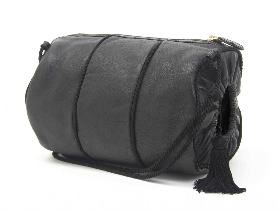 A Prada Black Leather Muff Bag, 9 x 8 x 4 1/2 inches.: A Prada Black Leather Muff Bag, zipper closure, with a passementerie cord strap and tassel. Stamped: Prada. 9 x 8 x 4 1/2 inches. Condition: Overall very good condition.