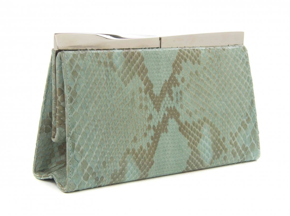 A Salvatore Ferragamo Aqua Snakeskin Clutch, 8 1/2 x 5: A Salvatore Ferragamo Aqua Snakeskin Clutch, silvertone clasp frame, with a drop in silvertone strap, and an interior zippered pocket. Stamped: Salvatore Ferragamo. 8 1/2 x 5 x 2 inches. Property dona