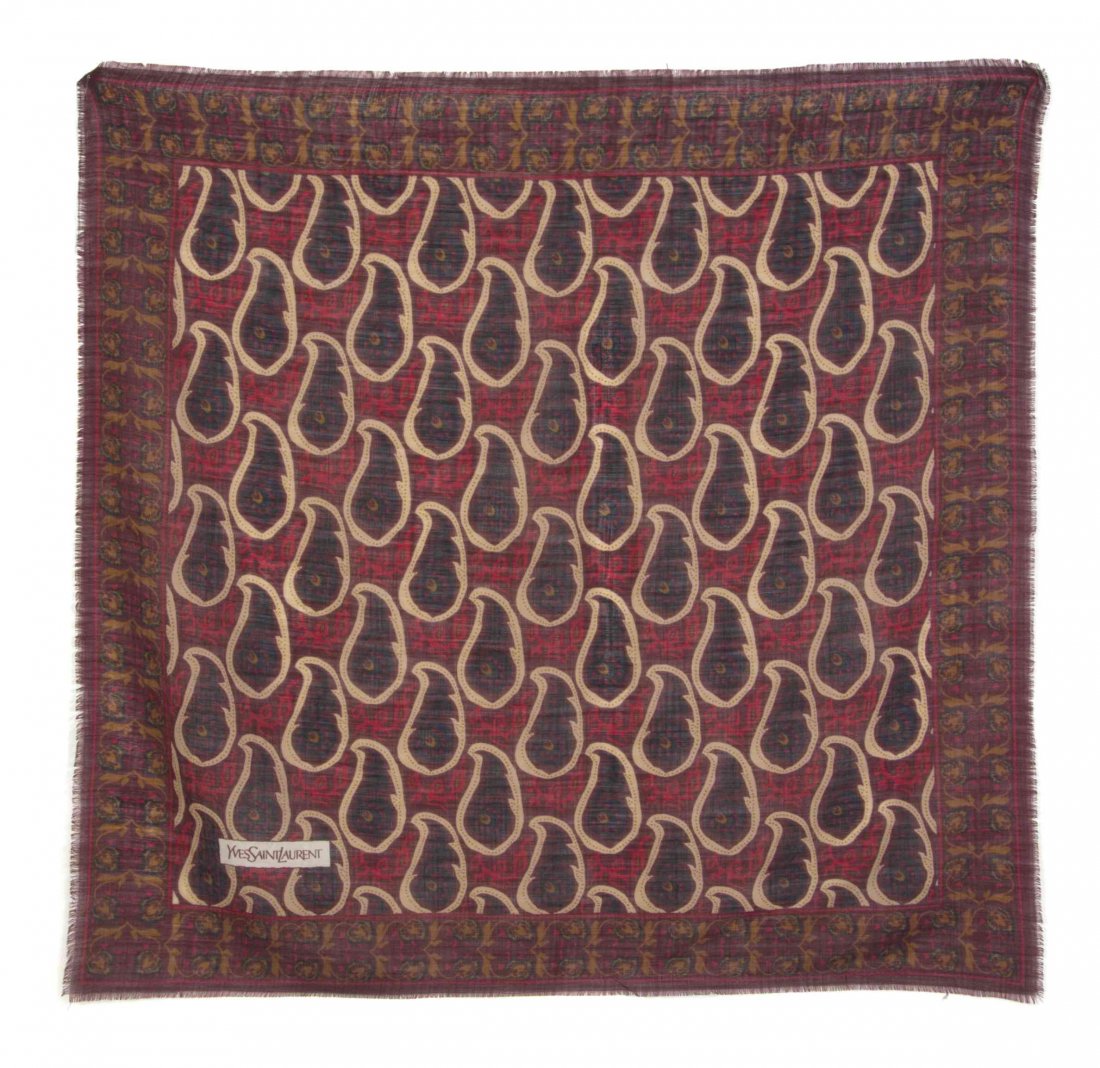 An Yves Saint Laurent Burgundy Cotton Scarf, 33 x 34: An Yves Saint Laurent Burgundy Cotton Scarf, in a paisley motif. Labeled within print: Yves Saint Laurent. 33 x 34 1/2 inches. Property from the Estate of Dorothy Parrott Hughes, Kenilworth, Illinois 