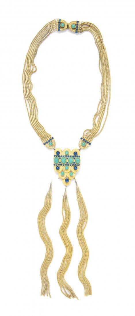 A Christian Dior Goldtone Multi Chain Necklace,: A Christian Dior Goldtone Multi Chain Necklace, with a scalloped goldtone pendant with blue and jade cabochon stones, and three goldtone chain tassels. Stamped: Christian Dior. Property from a Private