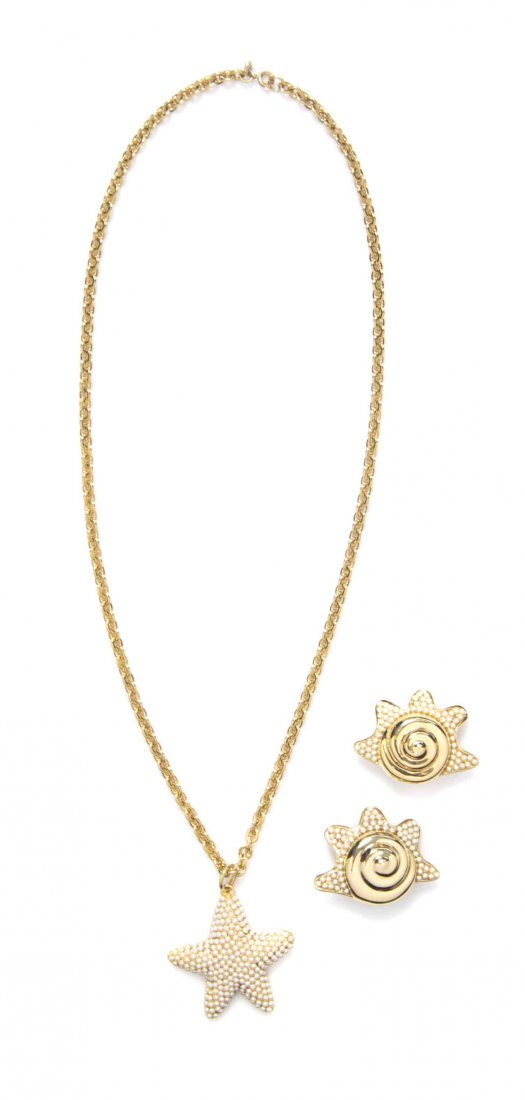 A Guy Laroche Seed Pearl Demi-Parure,: A Guy Laroche Seed Pearl Demi-Parure, comprised of a goldtone chain link necklace with a starfish pendant, together with a pair of swirled shell ear clips. Each stamped: Guy Laroche. Condition: Overal