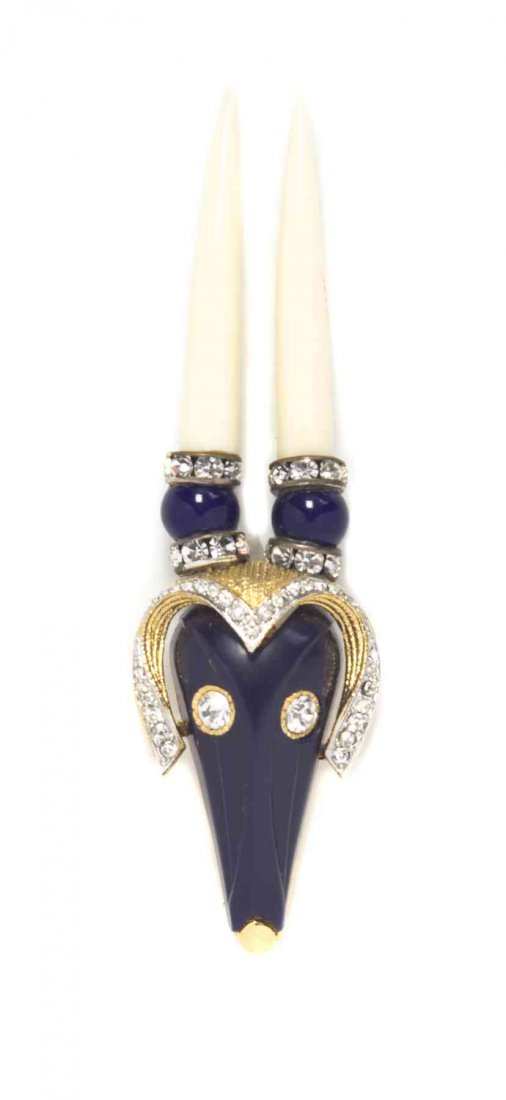 A Hattie Carnegie Cobalt Ram Brooch,: A Hattie Carnegie Cobalt Ram Brooch, with ivory horns, and rhinestone detailing throughout. Stamped: Hattie Carnegie. Property from a Private Collection Condition: Overall very good condition.