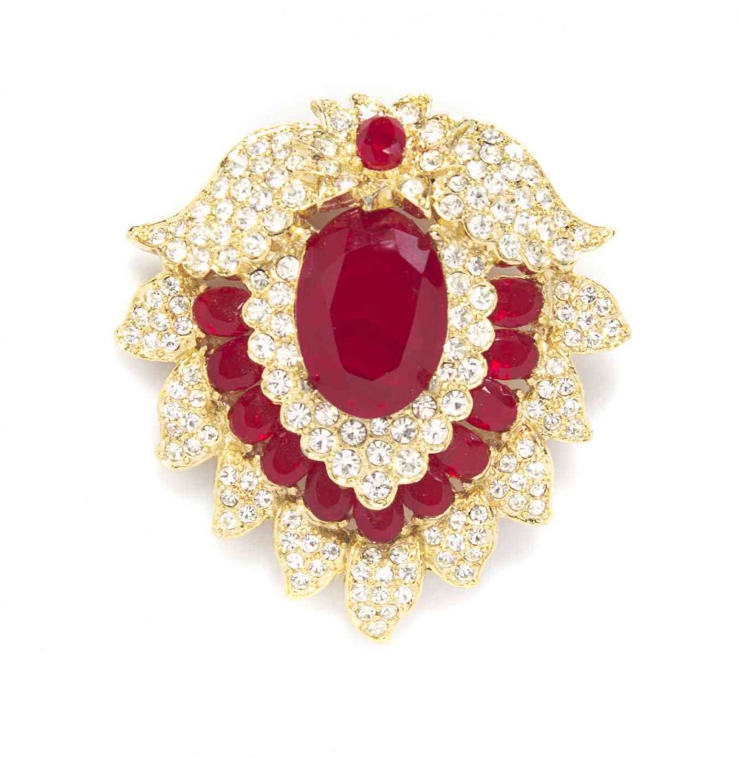 A Kenneth Jay Lane Faux Ruby Brooch,: A Kenneth Jay Lane Faux Ruby Brooch, in a petal motif, with all-over pave rhinestones. Stamped: Kenneth Lane. Property from a Private Collection Condition: Overall very good condition. Please note the