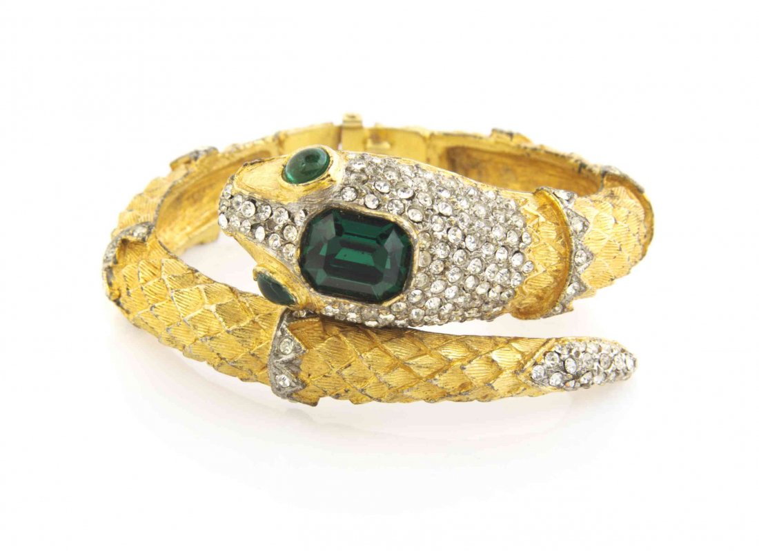 A Kenneth Jay Lane Faux Emerald Snake Bracelet,: A Kenneth Jay Lane Faux Emerald Snake Bracelet, with a pave rhinestone head and tail. Stamped: K. J. L. Property from a Private Collection Condition: Overall very good condition. Please note the follo