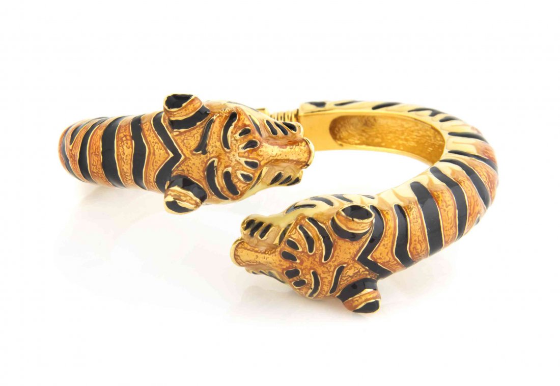 A Kenneth Jay Lane Enamel Bracelet,: A Kenneth Jay Lane Enamel Bracelet, with twin tiger heads. Stamped: KJL. Condition: Overall very good condition.