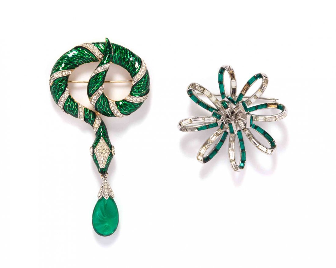 A Pair of Trifari Brooches,: A Pair of Trifari Brooches, comprised of a green enamel and rhinestone snake brooch, together with a green and white rhinestone flower brooch. Each stamped: Trifari. Condition: Overall good condition.