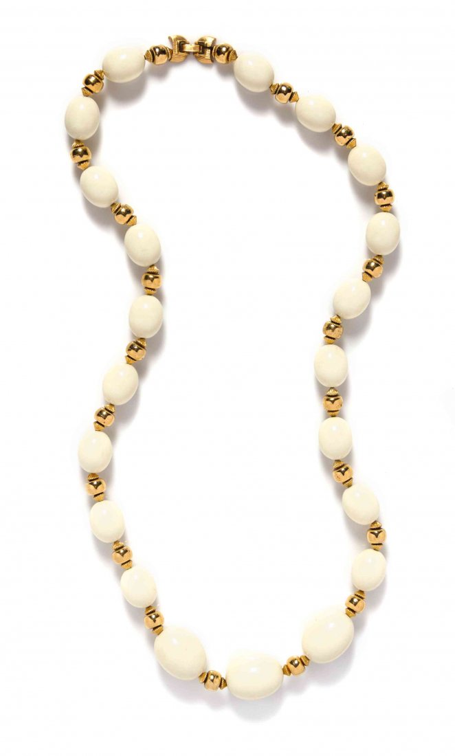 A Crown Trifari Ivory Bead and Goldtone Necklace.: A Crown Trifari Ivory Bead and Goldtone Necklace. Stamped: Trifari. Condition: Overall very good condition. Please note the following: Light scratching throughout.