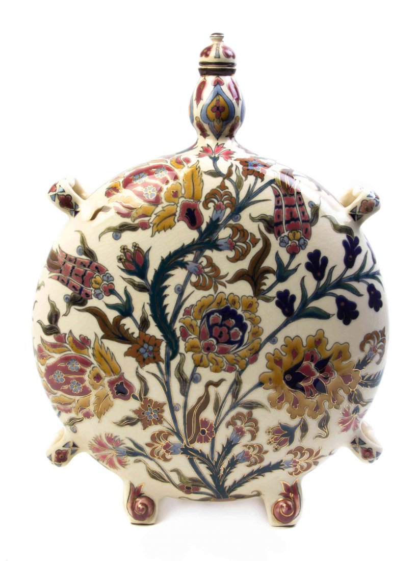 A Zsolnay Pottery Wine Flask, 20TH CENTURY, Height 19: A Zsolnay Pottery Wine Flask, 20TH CENTURY, enameled to show flowering branches on an ivory ground. Height 19 inches. Property from the Collection of Harry and Pola Triandis, Urbana, Illinois
