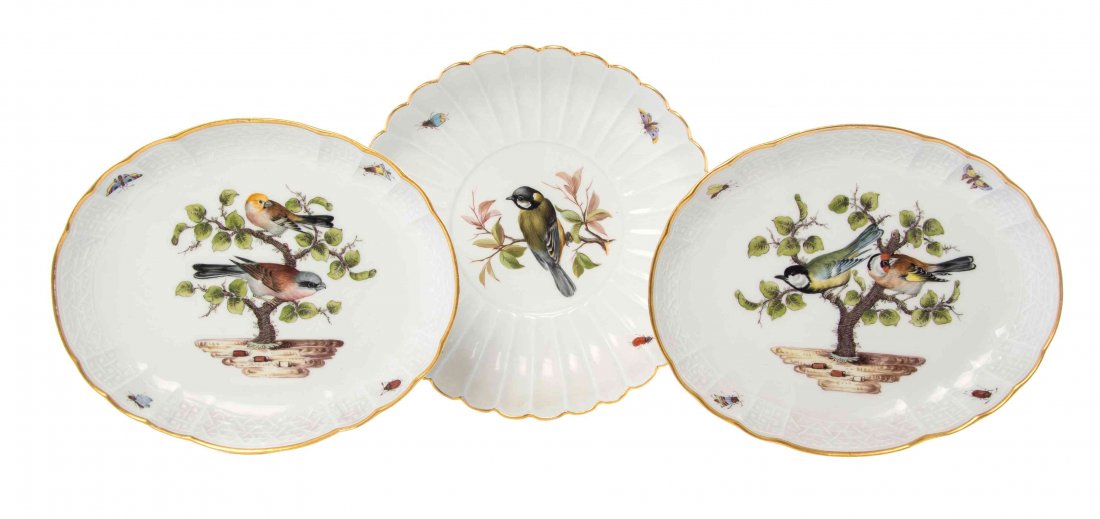 A Group of Three Meissen Porcelain Ornithological: A Group of Three Meissen Porcelain Ornithological Plates, comprising two of oval form with insect borders and a circular example with a scalloped rim, each having crossed swords mark in underglaze blu